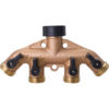 This image shows a brass manifold with four outlets, each with a black valve handle, designed to distribute water or gas in a plumbing system.