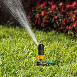 Melnor Turbo Rotary Sprinkler spraying water on green grass