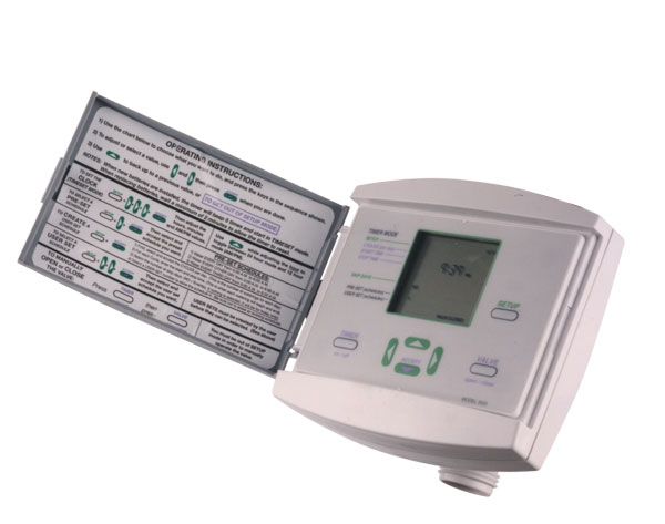 This is a programmable thermostat mounted on a wall, displaying a temperature of 69 degrees. It has an LCD screen and several control buttons.