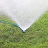 Melnor Circular Spot Sprinkler with large spray pattern watering green lawn