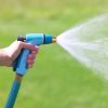 Sprout Gooseberry Green adjustable nozzle spraying water in front of green grass