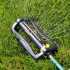 Melnor Turbo Oscillating Sprinkler spraying water over green lawn