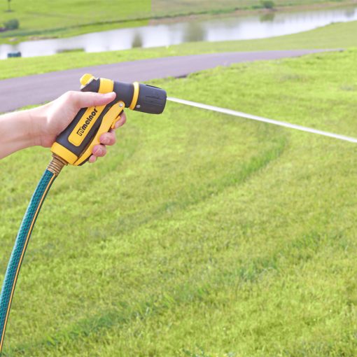 Melnor Vortex Front-Trigger 3-Pattern Nozzle jet spray pattern in front of driveway and green grass